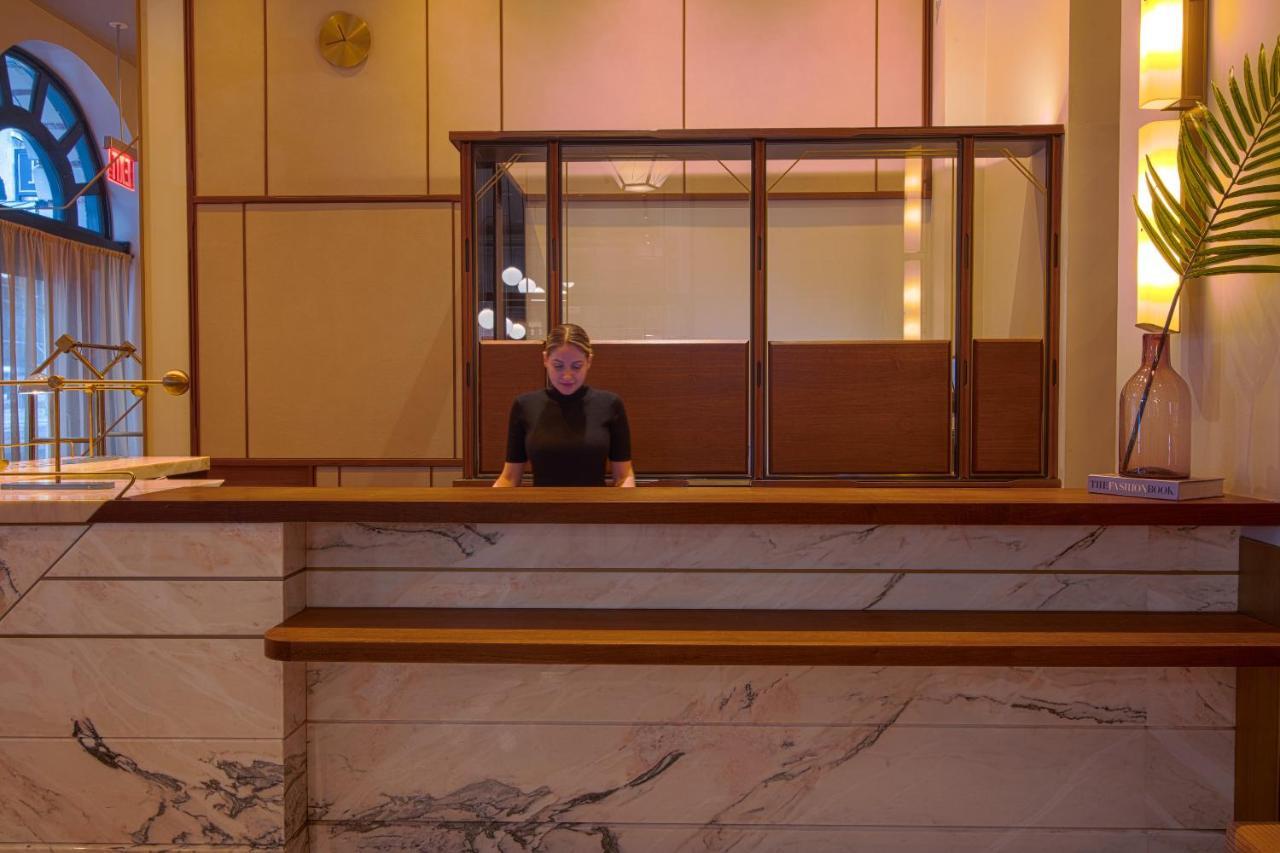 The Evelyn Nomad Hotel New York City Exterior photo A hotel receptionist at the front desk