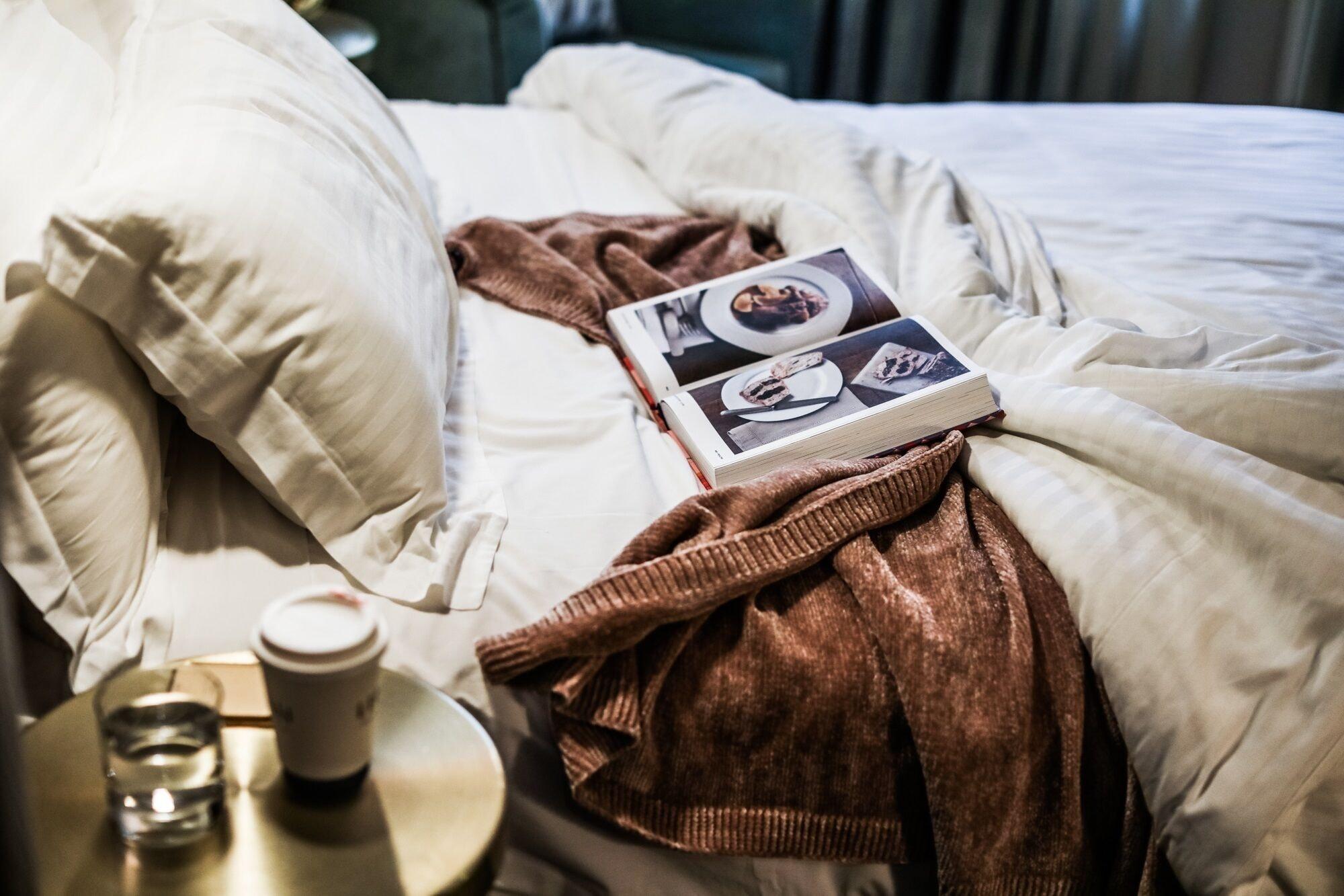 The Evelyn Nomad Hotel New York City Exterior photo A bed with a throw