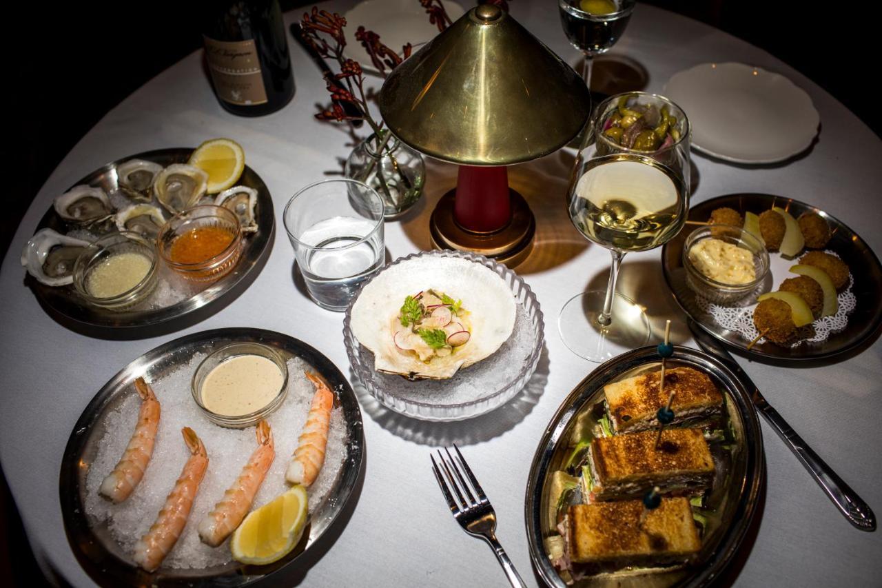 The Evelyn Nomad Hotel New York City Exterior photo A selection of dishes at the restaurant